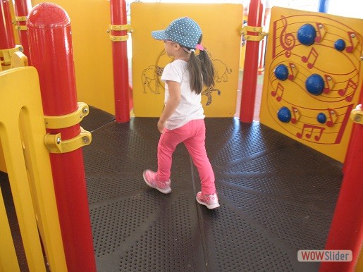 a child is in the playplace at the tactile playground